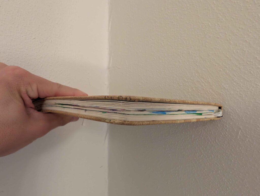 A colorful side view of an art notebook.